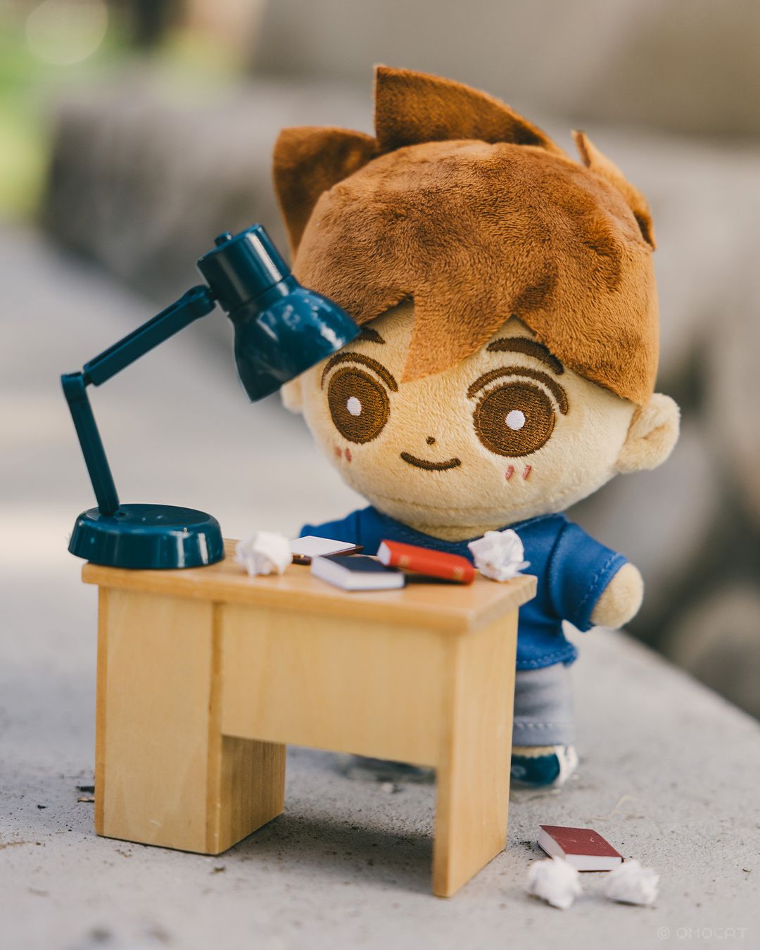 Finding a spot for HERO along the park was difficult. I settled on an area that looked kind of like a college campus. He has a lot of crumpled paper on the table and floor, just like at my desk at home.